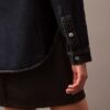 Avslappnad denimskjorta med knappar Avslappnad denimskjorta med knappar