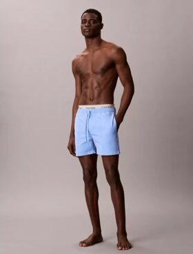 Badshorts med logotyp i midjan Badshorts med logotyp i midjan