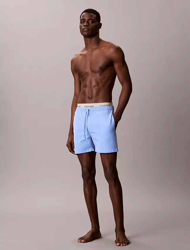 Badshorts med logotyp i midjan Badshorts med logotyp i midjan