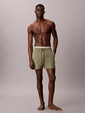 Badshorts med logotyp i midjan Badshorts med logotyp i midjan