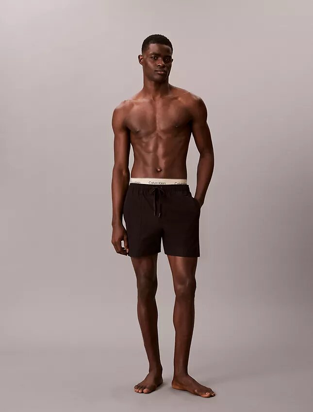 Badshorts med logotyp i midjan Badshorts med logotyp i midjan