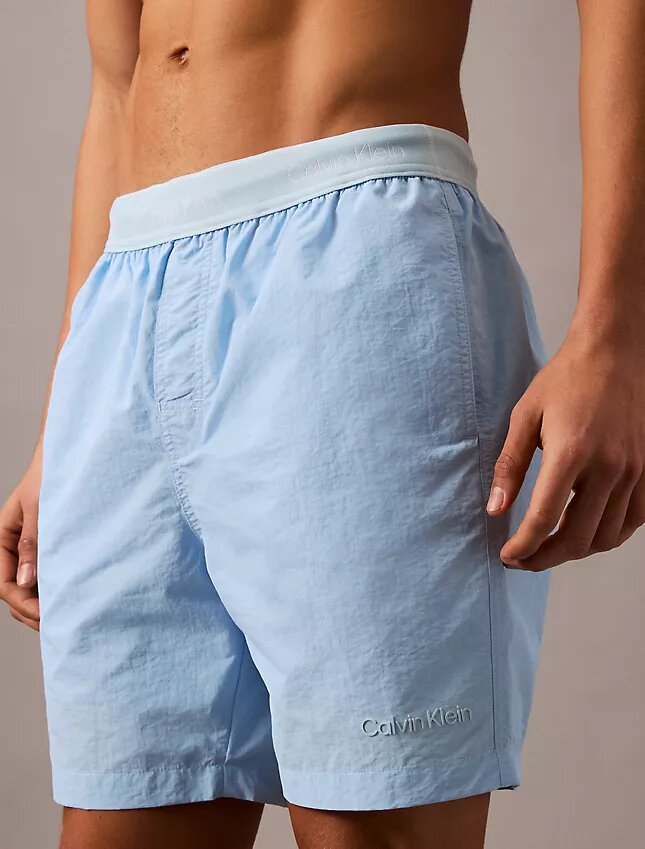 Badshorts med logotyp i midjan Badshorts med logotyp i midjan