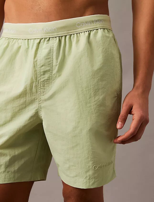 Badshorts med logotyp i midjan Badshorts med logotyp i midjan