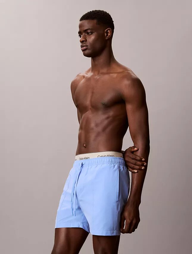 Badshorts med logotyp i midjan Badshorts med logotyp i midjan