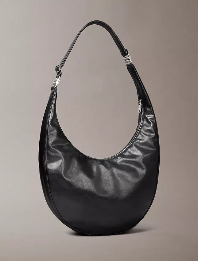 Böjd, omvandlingsbar crossbody-väska Böjd, omvandlingsbar crossbody-väska