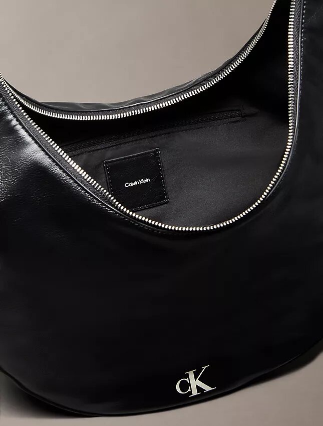 Böjd, omvandlingsbar crossbody-väska Böjd, omvandlingsbar crossbody-väska
