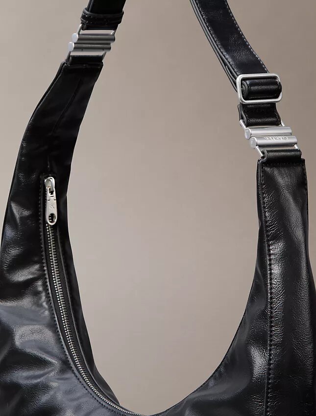 Böjd, omvandlingsbar crossbody-väska Böjd, omvandlingsbar crossbody-väska