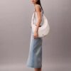 Böjd, omvandlingsbar crossbody-väska Böjd, omvandlingsbar crossbody-väska