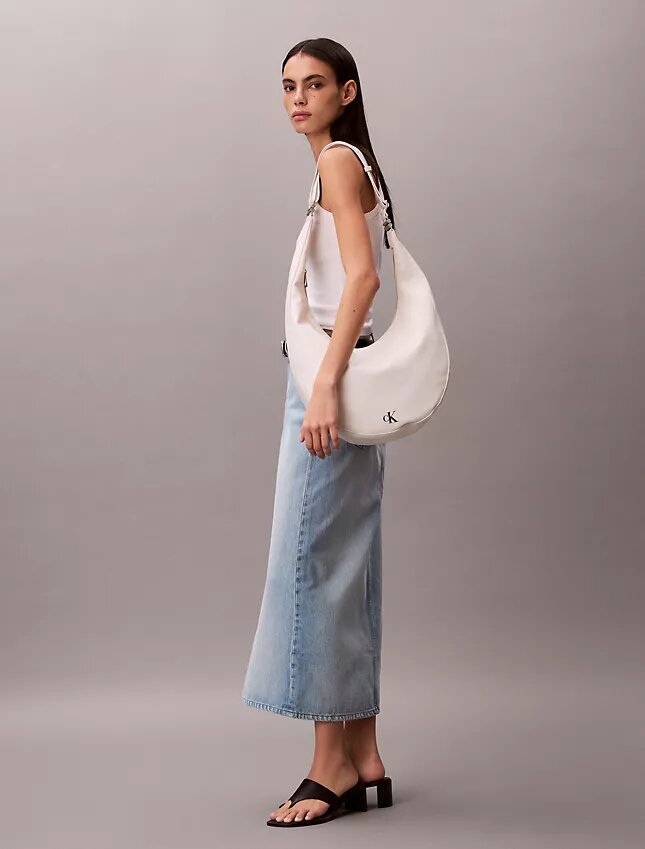 Böjd, omvandlingsbar crossbody-väska Böjd, omvandlingsbar crossbody-väska