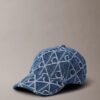 Denim-baseballkeps med emblem-logotyp över hela ytan