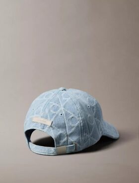 Denim-baseballkeps med emblem-logotyp över hela ytan