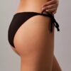 Enfärgad bikini-underdel med knytband i sidorna Enfärgad bikini-underdel med knytband i sidorna