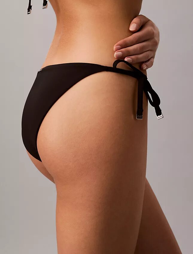 Enfärgad bikini-underdel med knytband i sidorna Enfärgad bikini-underdel med knytband i sidorna