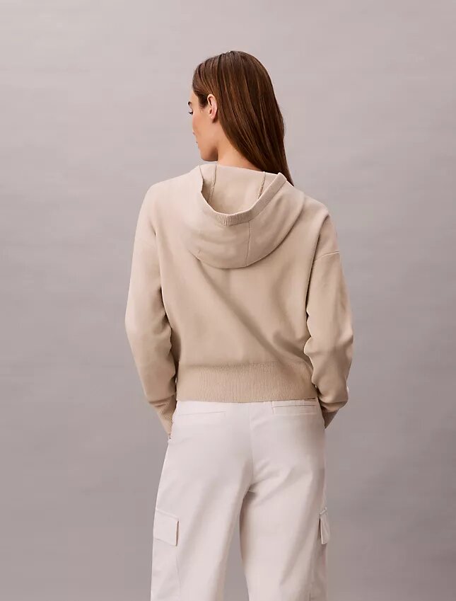 Hoodie i avslappnad stickning Hoodie i avslappnad stickning