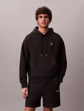 Hoodie i premiumfrotté med avslappnad passform och Monogram