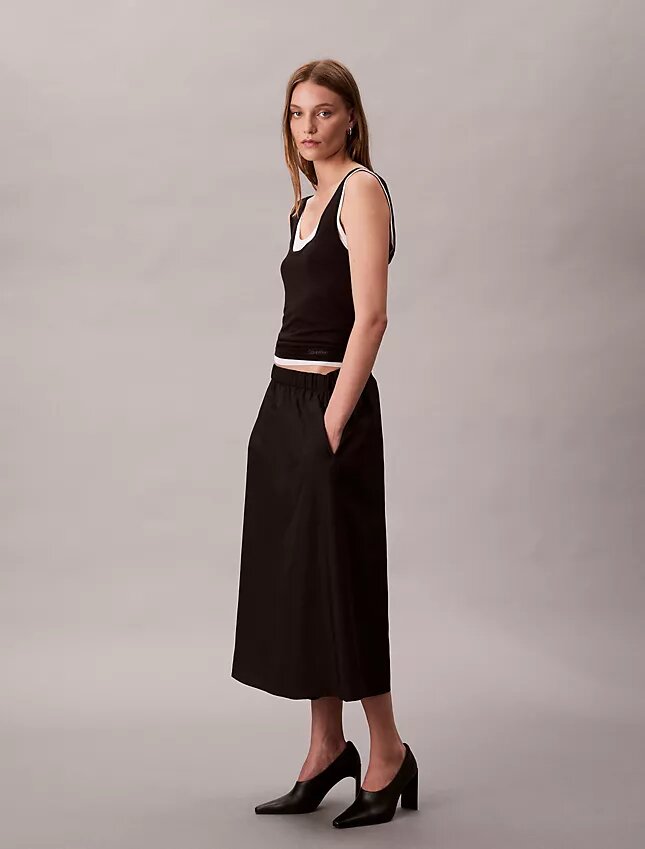 Midi-kjol i nylon med dragkedja Midi-kjol i nylon med dragkedja