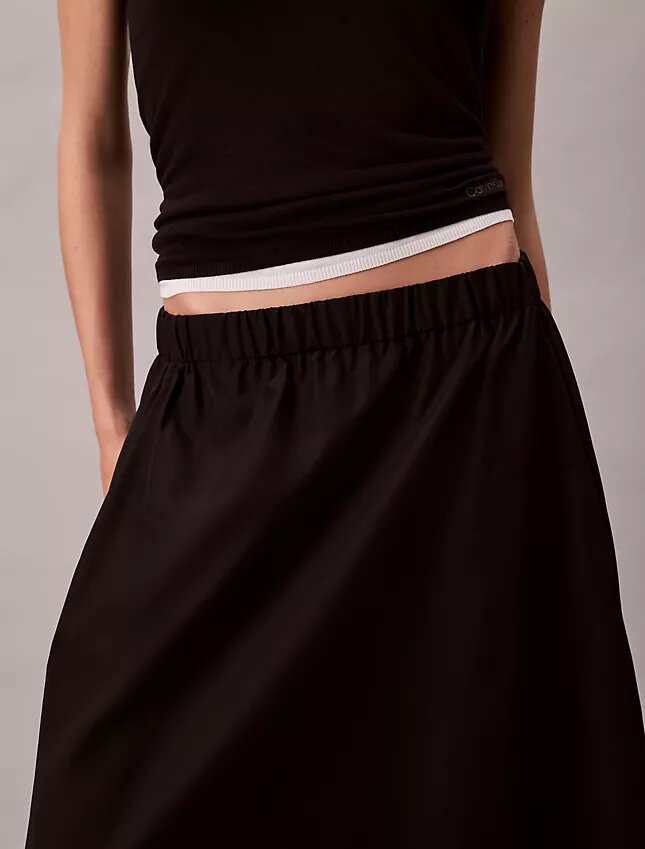 Midi-kjol i nylon med dragkedja Midi-kjol i nylon med dragkedja