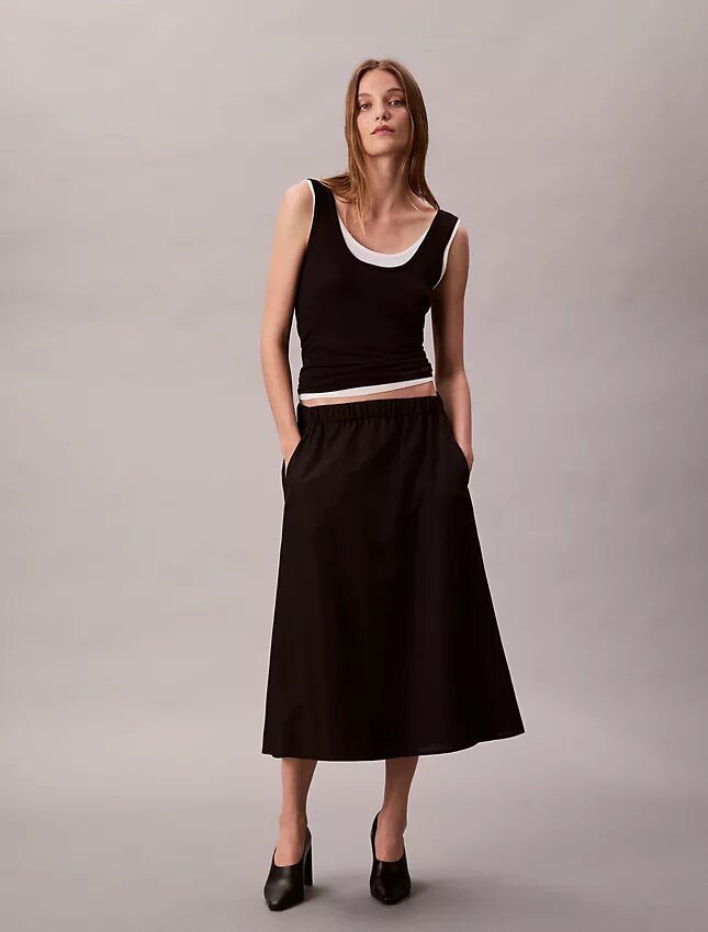Midi-kjol i nylon med dragkedja Midi-kjol i nylon med dragkedja