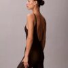 Minimalistisk bodysuit i mesh som slutar vid mitten av låret Minimalistisk bodysuit i mesh som slutar vid mitten av låret