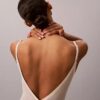 Minimalistisk bodysuit i mesh som slutar vid mitten av låret Minimalistisk bodysuit i mesh som slutar vid mitten av låret