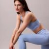 Moderna sportleggings med hög midja och logotyp i linningen, 7/8-längd Moderna sportleggings med hög midja och logotyp i linningen, 7/8-längd