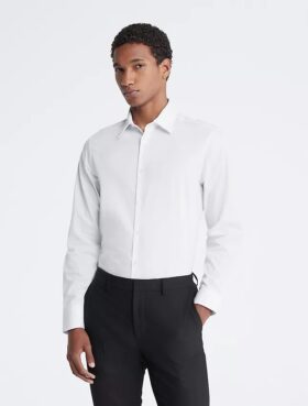 Slim fit-klänning i bomull med fiskbensmönster Slim fit-klänning i bomull med fiskbensmönster