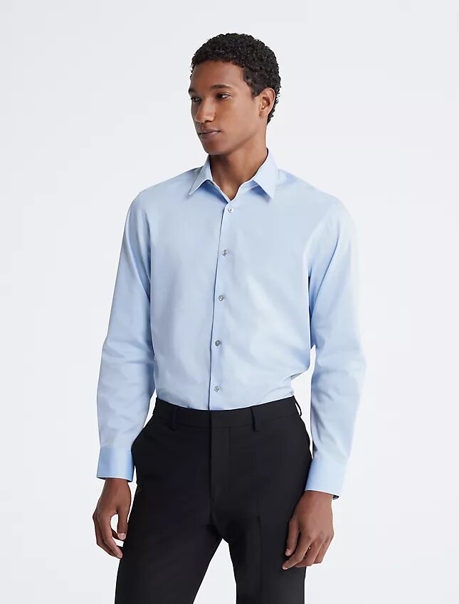 Slim fit-klänning i bomull med fiskbensmönster Slim fit-klänning i bomull med fiskbensmönster