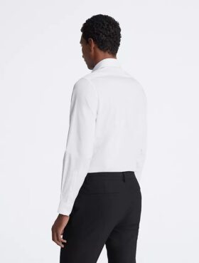 Slim fit-klänning i bomull med fiskbensmönster Slim fit-klänning i bomull med fiskbensmönster