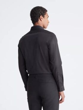 Slim fit-klänning i bomull med fiskbensmönster Slim fit-klänning i bomull med fiskbensmönster