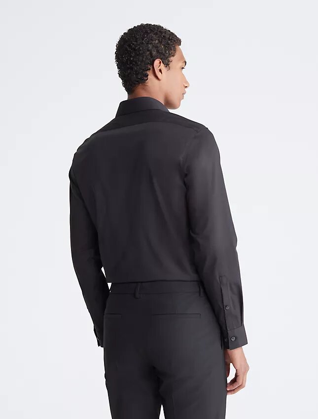 Slim fit-klänning i bomull med fiskbensmönster Slim fit-klänning i bomull med fiskbensmönster