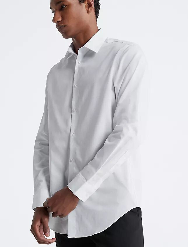 Slim fit-klänning i bomull med fiskbensmönster Slim fit-klänning i bomull med fiskbensmönster
