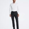 Slim fit-klänning i bomull med fiskbensmönster Slim fit-klänning i bomull med fiskbensmönster
