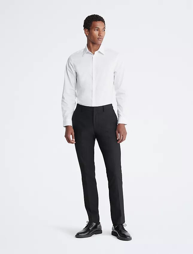 Slim fit-klänning i bomull med fiskbensmönster Slim fit-klänning i bomull med fiskbensmönster