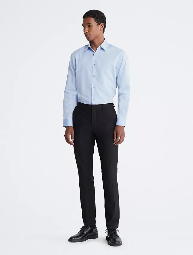 Slim fit-klänning i bomull med fiskbensmönster Slim fit-klänning i bomull med fiskbensmönster