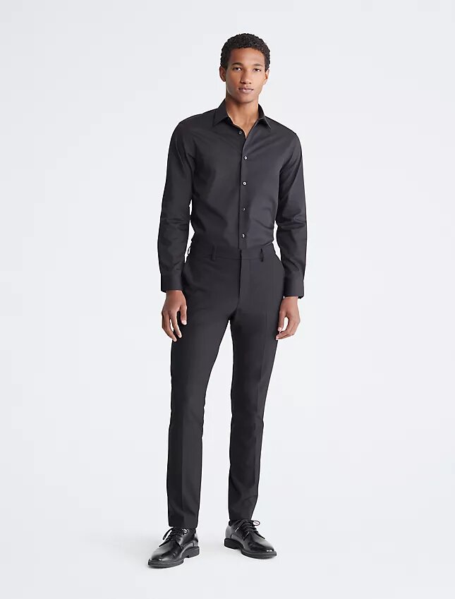 Slim fit-klänning i bomull med fiskbensmönster Slim fit-klänning i bomull med fiskbensmönster