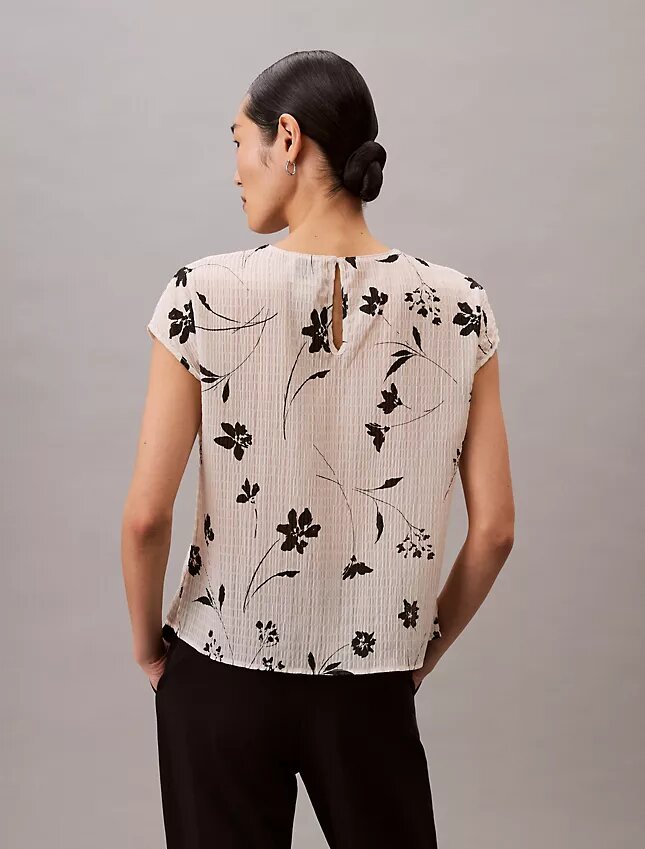 Smockad topp med blommönster Smockad topp med blommönster