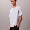 T-shirt med emblem och grafisk logotyp T-shirt med emblem och grafisk logotyp