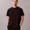 T-shirt med emblem och grafiskt tryck T-shirt med emblem och grafiskt tryck