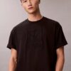 T-shirt med emblem och grafiskt tryck T-shirt med emblem och grafiskt tryck