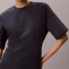 T-shirtklänning med ribbad interlock och logotyp