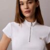 Vävd Monologo-topp med ribbade ärmar och kvartslång dragkedja Vävd Monologo-topp med ribbade ärmar och kvartslång dragkedja